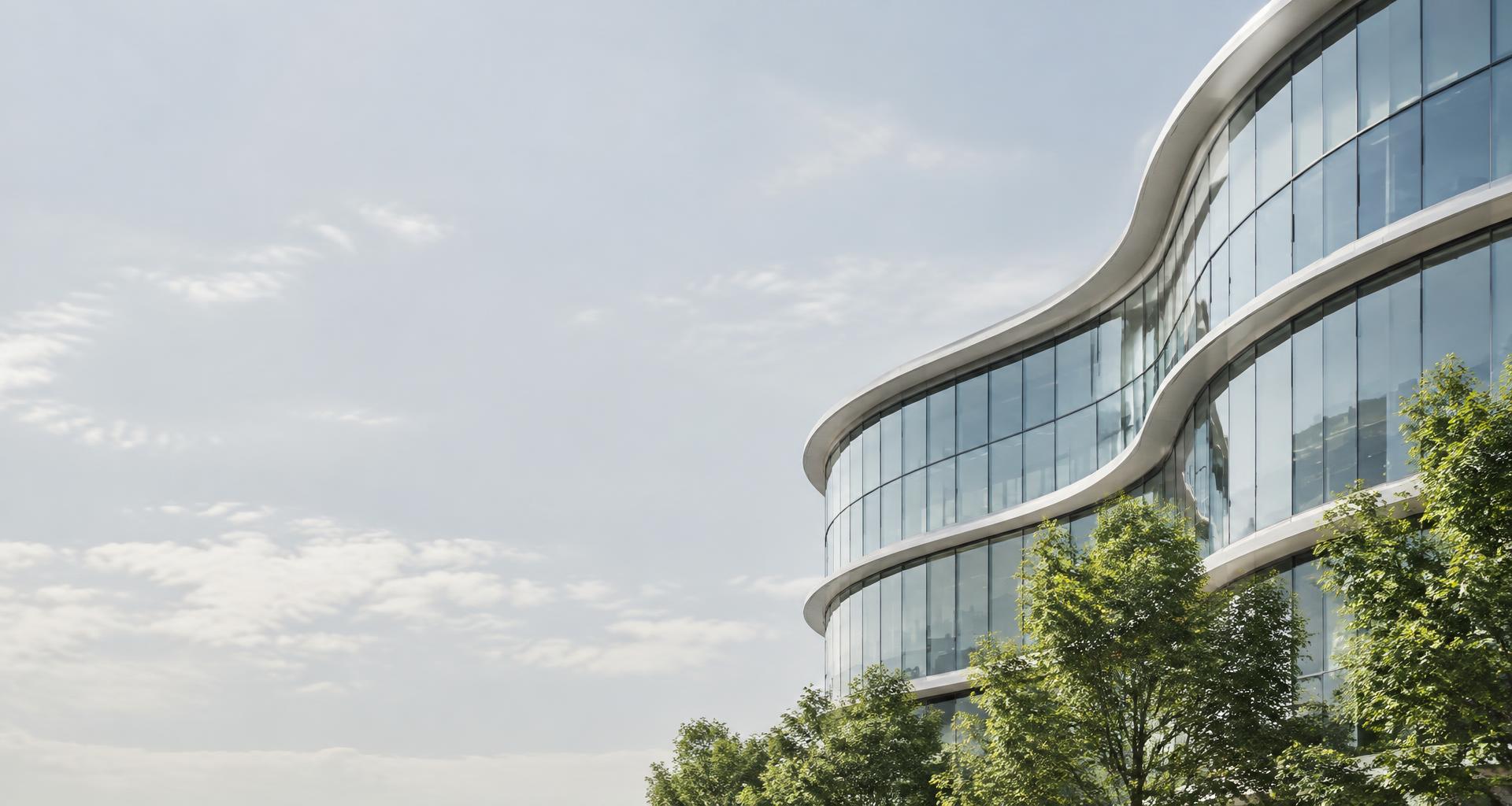 Modern glass architecture surrounded by greenery